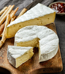 Sticker - camembert cheese on wooden cutting board