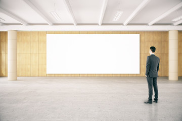 Canvas Print - Man looking at empty poster