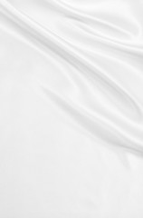 Smooth elegant white silk or satin luxury cloth texture as weddi
