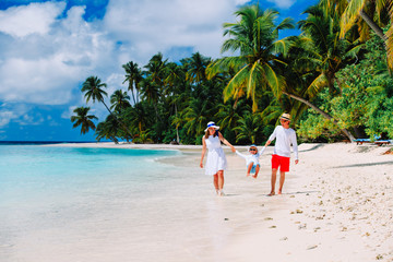 Wall Mural - family with kid playing on tropical beach