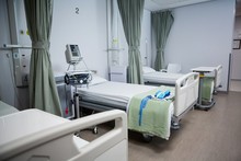 View Of Empty Hospital Beds In Ward