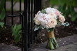 Wedding bouquet for the bride and bridal party with peonies, roses, pink, peach and white