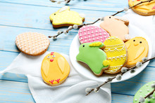 Colorful Easter Cookies On Blue Wooden Background