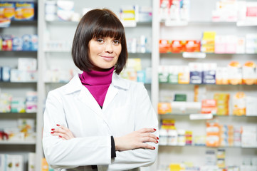 Wall Mural - pharmacceutist woman worker in drug store