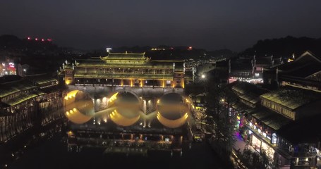 Poster - Hong Bridge at night in Fenghuang Ancient town, Hunan province, China. This ancient town was added to the UNESCO World Heritage Tentative List in the Cultural category.