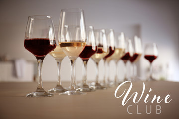 Wall Mural - Glasses of different wine on table. Text WINE CLUB on background
