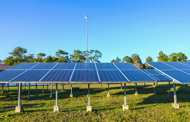 Wall Mural - solar energy panels and wind turbine ,clean energy background and blue sky