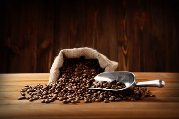 Poster - Coffee beans with scoop on table