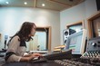 © Wavebreak Media - Audio engineer using sound mixer