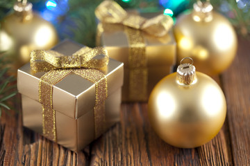 Sticker - Gift boxes and Christmas balls on wooden table