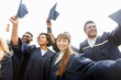 © Syda Productions - happy students or bachelors waving mortar boards