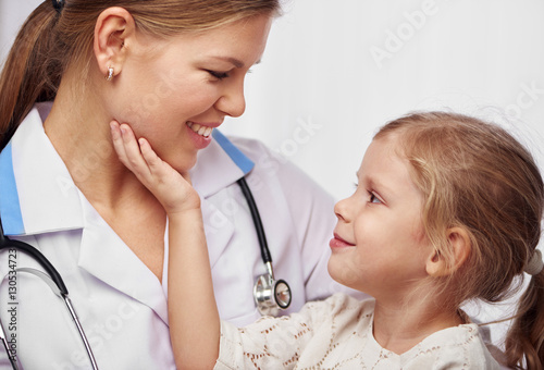 Friendly Female Pediatrician Doing Medical Examination Of Little Girl In Hospital Stock Photo Adobe Stock