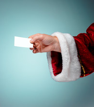Photo Of Santa Claus Hand With A Business Card