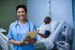 © WavebreakMediaMicro - Portrait of female nurse standing with file in ward