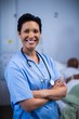 © WavebreakMediaMicro - Portrait of female nurse standing in ward