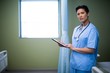 © WavebreakMediaMicro - Portrait of female nurse using digital tablet in ward