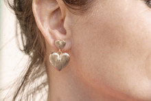 Woman Wearing A Heart Shape Earring