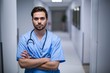 © WavebreakMediaMicro - Portrait of male nurse standing in corridor
