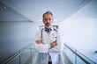 © WavebreakMediaMicro - Portrait of doctor standing in corridor