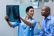 Nurse discussing x-ray with patient