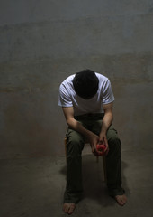 Wall Mural - Young man with head down