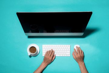 Top view of businessman hands busy using laptop at office desk,