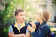 © artmim - Young Boy and Girl Blowing a Dandelion Flowers. Happy Kids Outdo
