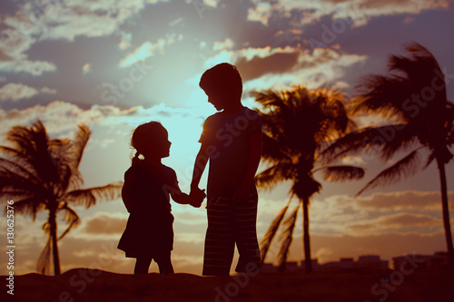 Little Boy And Girl Holding Hands At Sunset Beach Stock Photo Adobe Stock Little Boy And Girl Holding Hands At Sunset Beach Stock Photo Adobe Stock