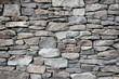 Leinwandbild Motiv Grey stone siding with different sized stones