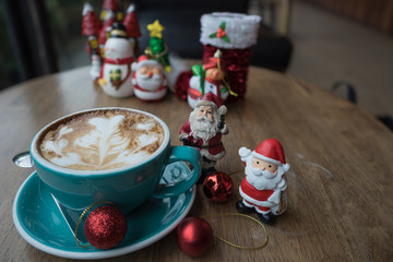 Christmas day and new year Santa Claus hot coffee heart foam on wooden table day time