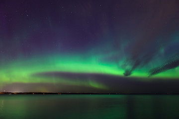 Wall Mural - northern lights over lake in finland