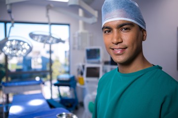 Poster - Portrait of male surgeon smiling in operation theater