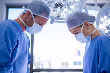Poster - Surgeons performing operation in operation theater