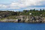 Fototapeta Natura - Isolated house on a rocky island - Norway