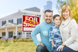 © Andy Dean - Happy Mixed Race Hispanic and Caucasian Family Portrait In Front of House and Sold For Sale Real Estate Sign.