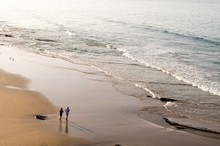 Couple Jogging At The Beach In Taghazout, Morocco