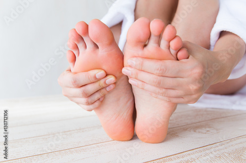 足裏を触る女性 Stock Photo Adobe Stock 足裏を触る女性 Stock Photo Adobe Stock