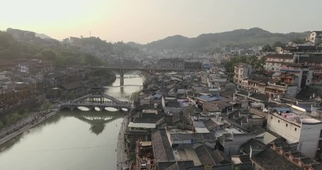 Poster - Top View or Aerial Shot of Famous Fenghuang (Phoenix) ancient town during sunset, Hunan province, China.