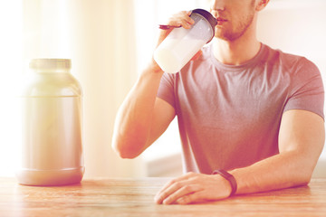 Wall Mural - close up of man drinking protein shake