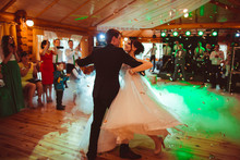 Beautiful And Young Bride And Groom Dancing Their First Dance