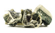Isolated crumpled dollar bills on a white background.
