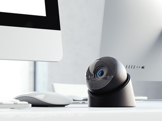 Modern black web camera on the office table . 3d rendering