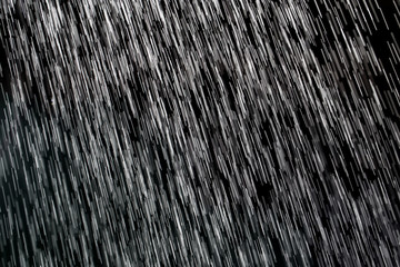 Canvas Print - rain on a black background