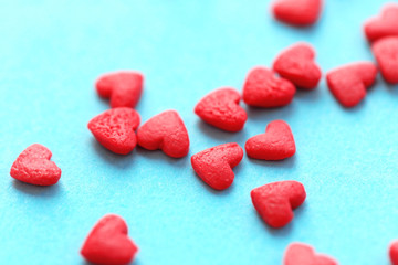 Sticker - Small candy hearts on paper background