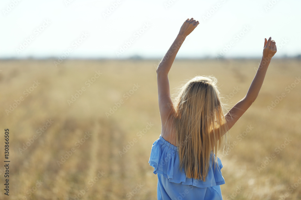 Young woman in field