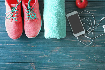 Wall Mural - Fitness equipment on wooden background