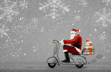 Santa Claus On Scooter Delivering Christmas Or New Year Gifts At Snowy Gray Background