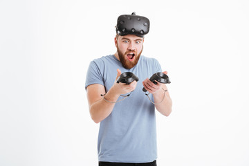 Wall Mural - Joyful cheerful man wearing virtual reality device