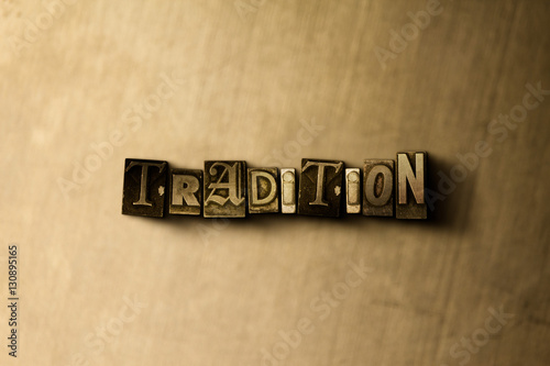 Fotografia TRADITION - close-up of grungy vintage typeset word on metal backdrop