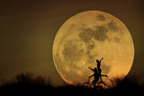 Fototapeta  - couple biking on moonlight